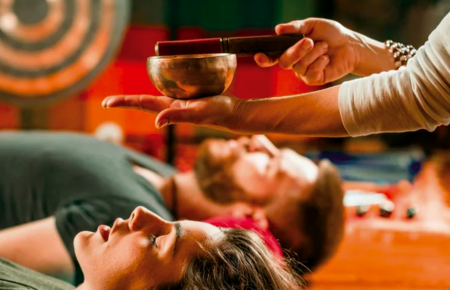 Sound healing session with Tibetan singing bowls at a Rishikesh yoga retreat